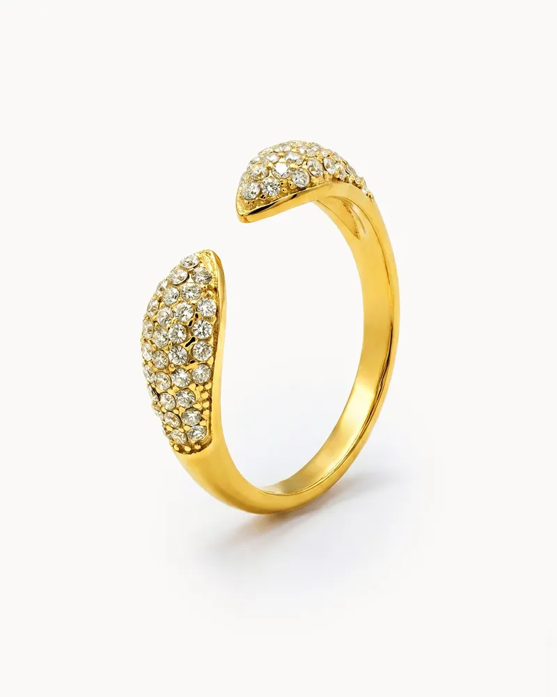 An open gold-tone ring set with clear stones